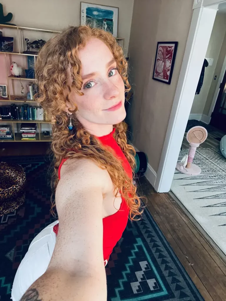 Scrumptious Glow: This Naughty Redhead Babydoll is Ready for Worship
