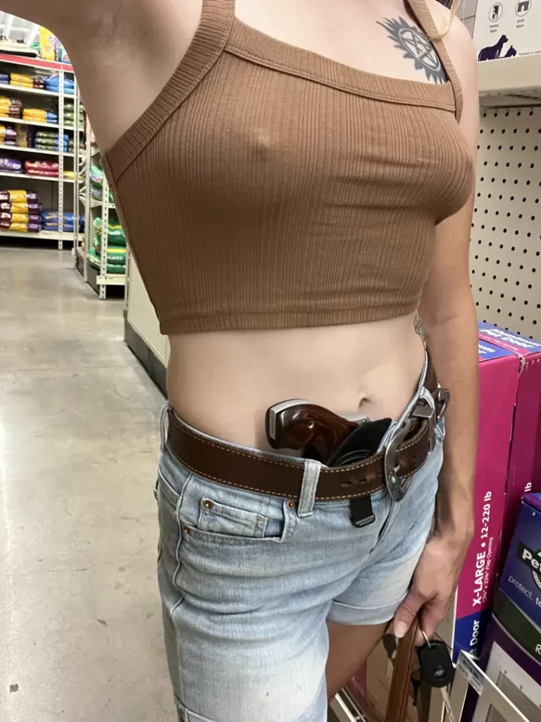 Tank Top Tease: Jeans, Tummy, and a Weapon Ready to Blow!